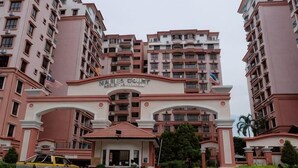 A multi-story residential building with a prominent entrance archway. - Nana Marina Court (Kota Kinabalu)