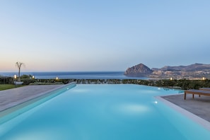 Seasonal outdoor pool, open 9:30 AM to 7:00 PM, pool umbrellas