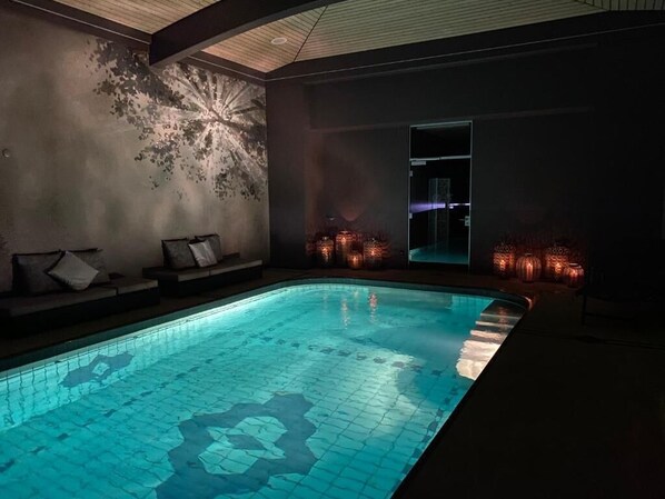 Indoor pool, pool umbrellas, pool loungers