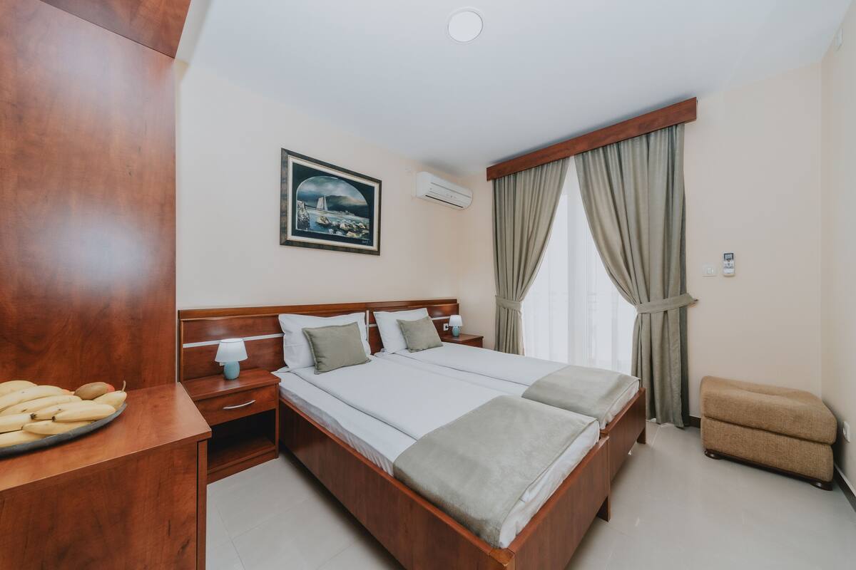 Premium bedding, memory-foam beds, desk, laptop workspace