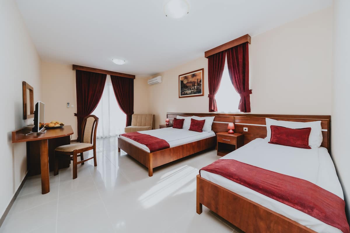 Premium bedding, memory-foam beds, desk, laptop workspace