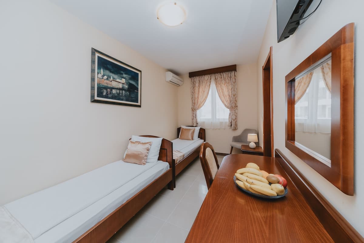 Premium bedding, memory-foam beds, desk, laptop workspace