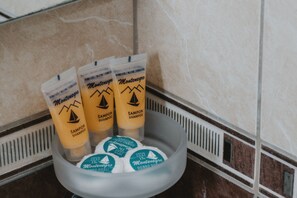 Shower, designer toiletries, hair dryer, towels
