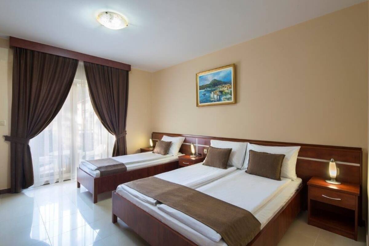 Premium bedding, memory-foam beds, desk, laptop workspace
