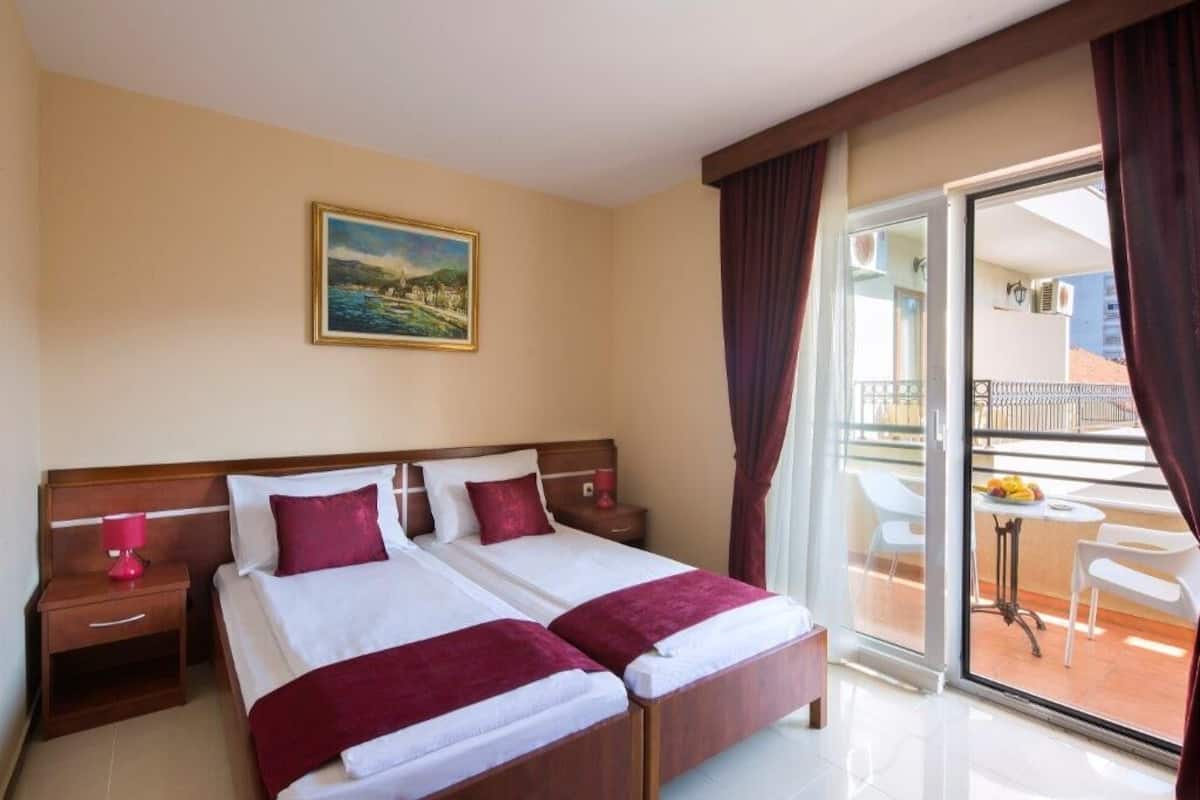 Premium bedding, memory-foam beds, desk, laptop workspace