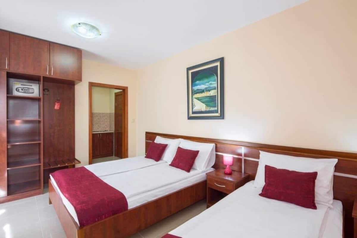 Premium bedding, memory-foam beds, desk, laptop workspace