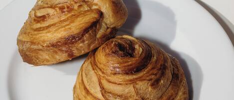 Two pastries on a white plate.