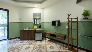 A kitchen with a refrigerator, a sink, and a wooden cabinet. - Avadale Tadoba - Stag Groups Not Allowed (Bhadravathi)