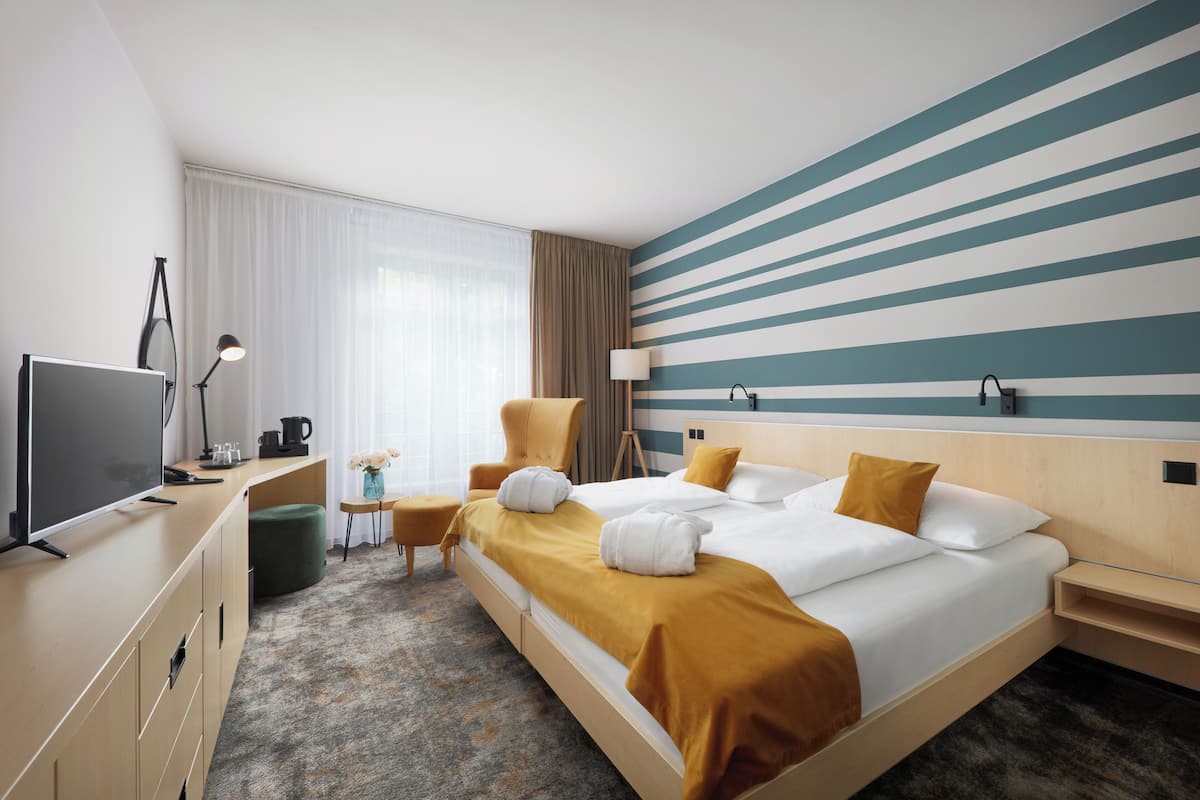 Superior Double or Twin Room, Pool Access | Minibar, in-room safe, desk, laptop workspace