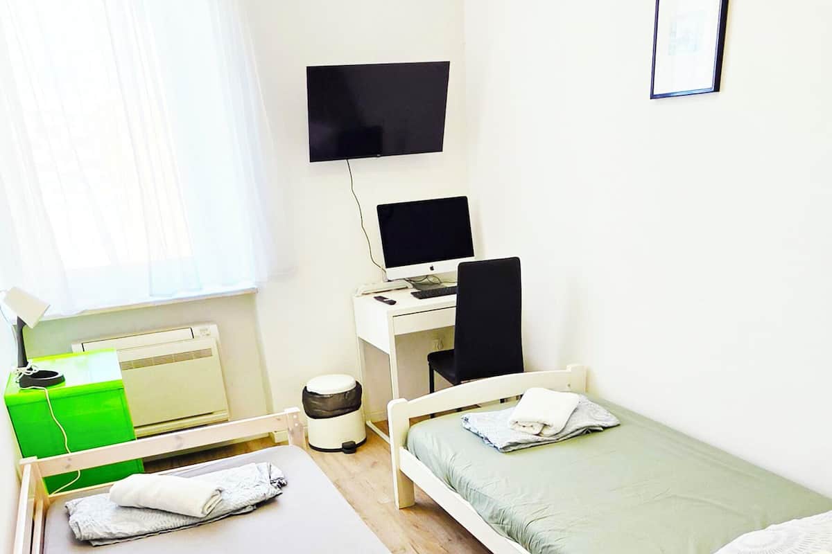 Room, 2 Twin Beds, Non Smoking, Shared Bathroom | Laptop workspace, WiFi (free), bed sheets