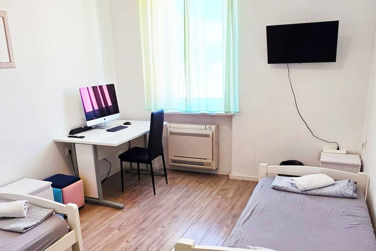 Laptop workspace, WiFi (free), bed sheets