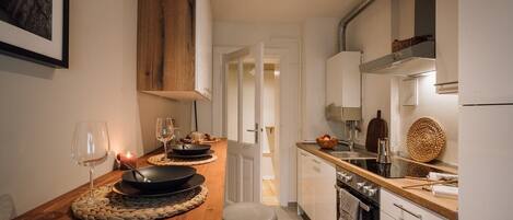 Fridge, stovetop, dishwasher, coffee/tea maker