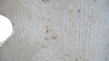 A white brick wall with a geometric pattern.