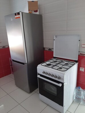 Fridge, oven, coffee/tea maker, cookware/dishes/utensils