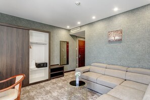 Suíte estúdio executiva | Área de estar