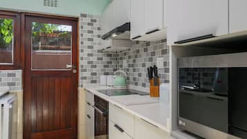Standard Villa | Private kitchen | Electric kettle, dining tables