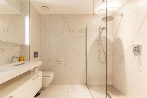 Shower, hair dryer, towels, soap