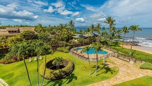 A resort with a pool, palm trees, and a beach view. - Polo Beach Club Two Bedrooms - Sleeps 6 by Coldwell Banker Island Vacations (Kihei)