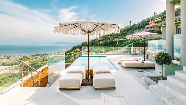 A rooftop infinity pool with white lounge chairs and a decorative umbrella, overlooking a scenic landscape. - Villa Ieros - Three Bedroom Villa, Sleeps 6 (Ionian Islands)
