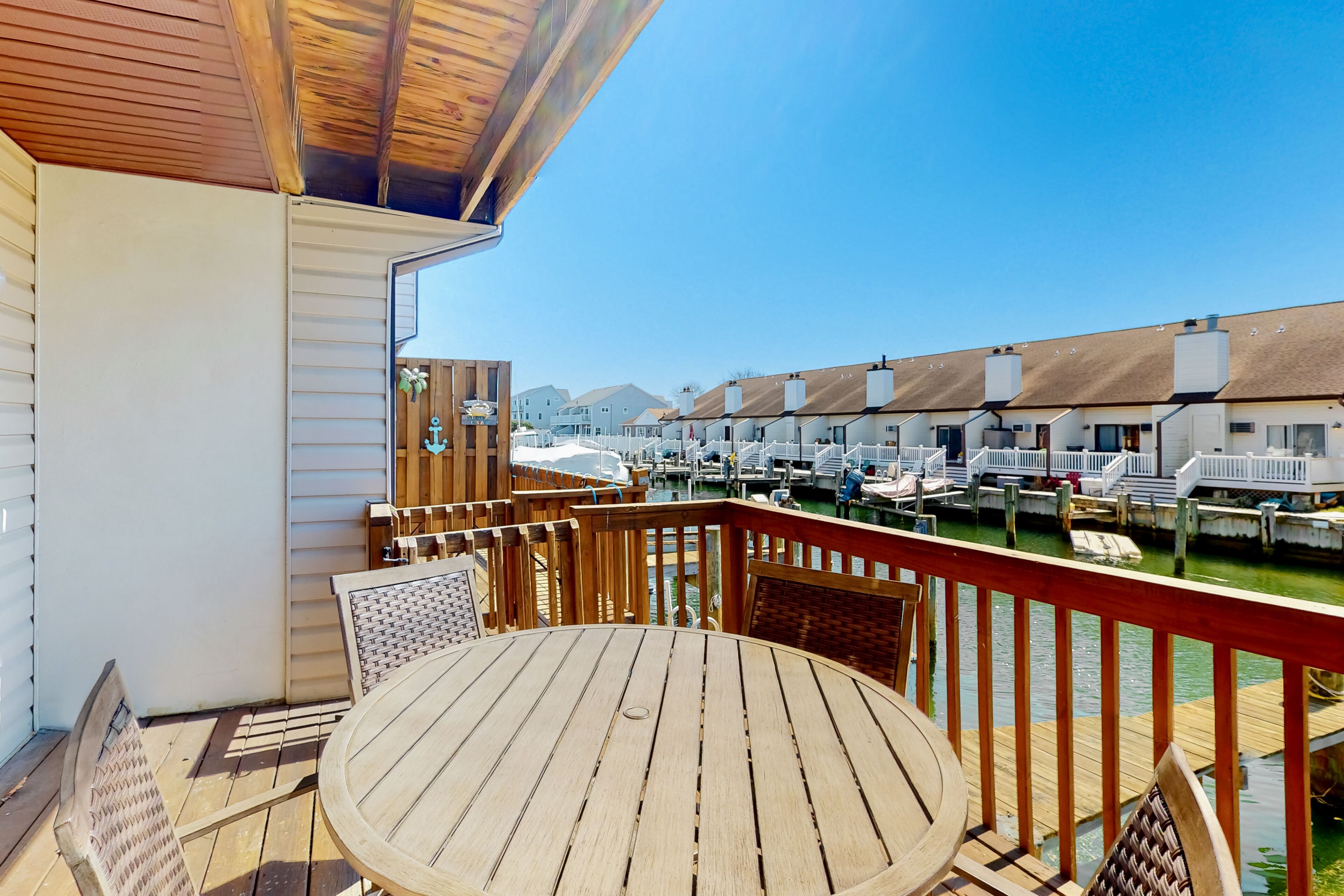 Dog-friendly, waterfront townhome with a scenic balcony, wood-burning fireplace