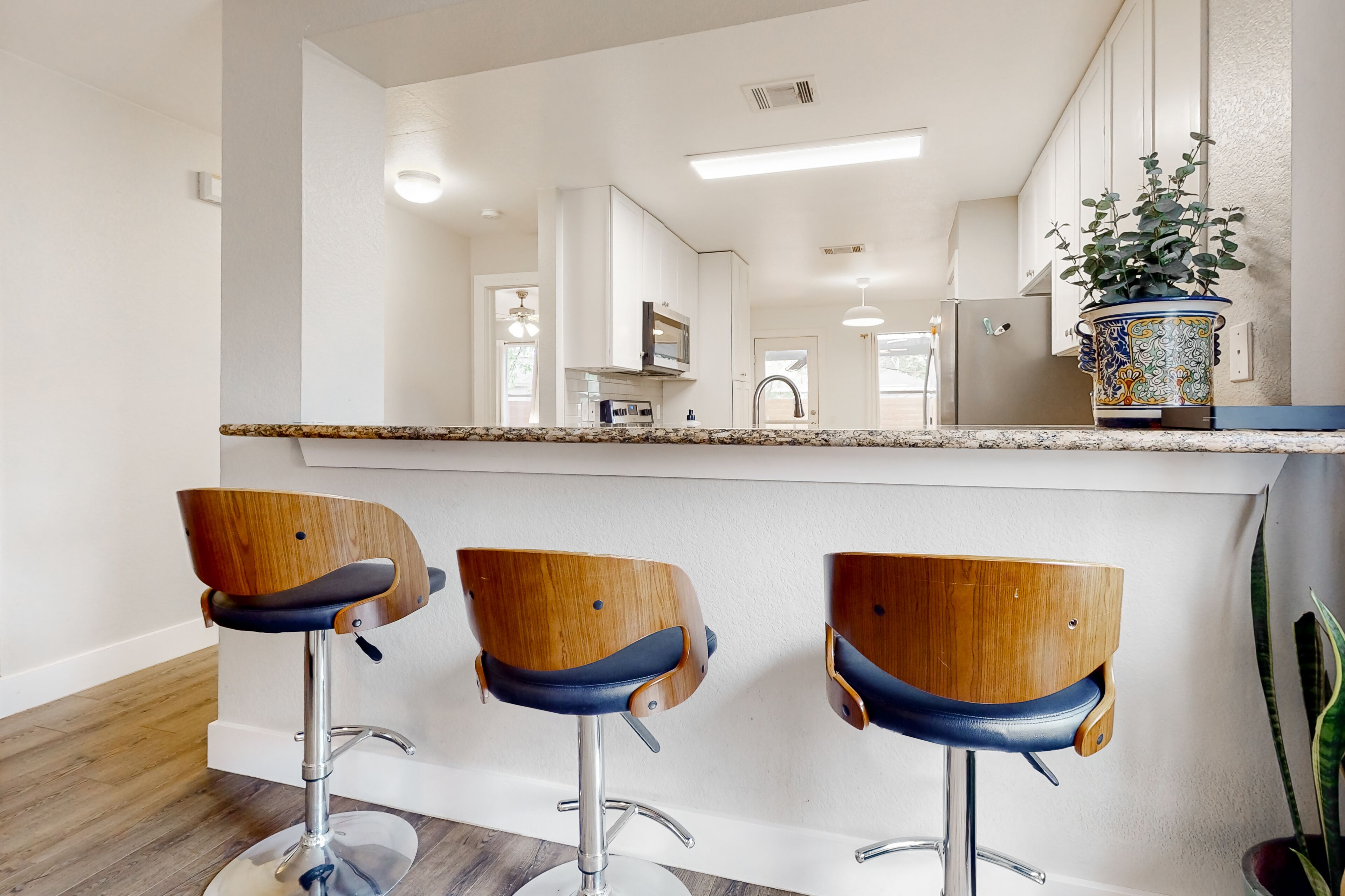 Conveniently located home with enclosed yard, covered patio, AC, & W/D