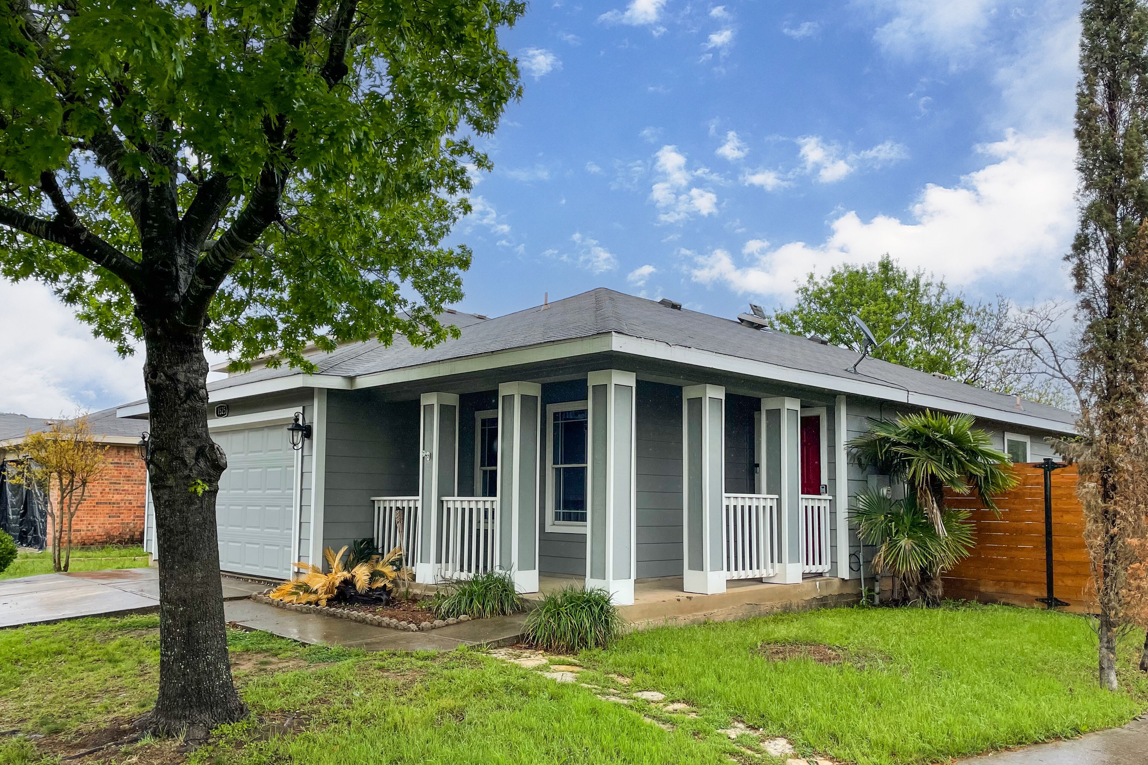 Conveniently located home with enclosed yard, covered patio, AC, & W/D