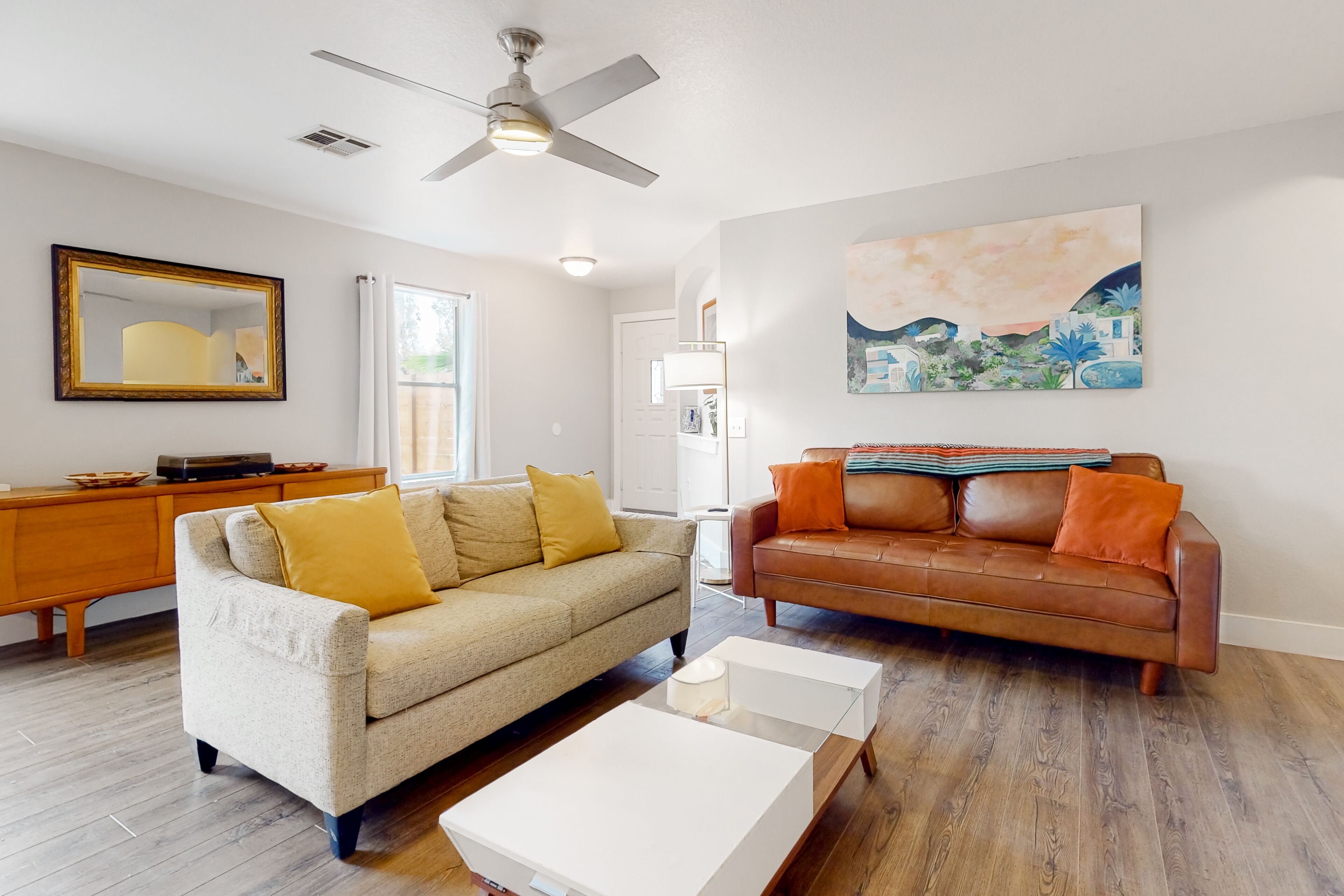 Conveniently located home with enclosed yard, covered patio, AC, & W/D