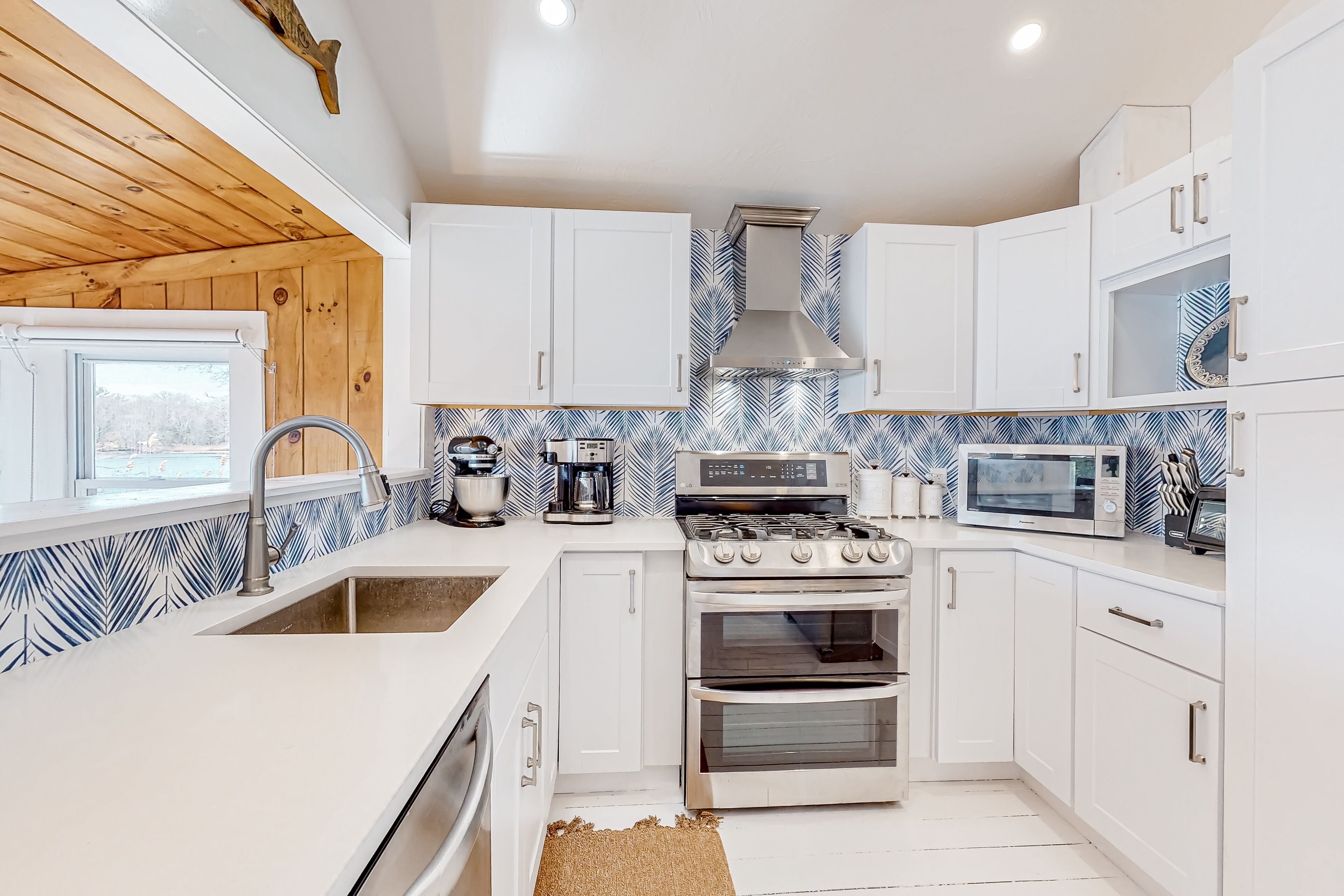 Single-level riverfront retreat with a dock, electric fireplace, & washer/dryer