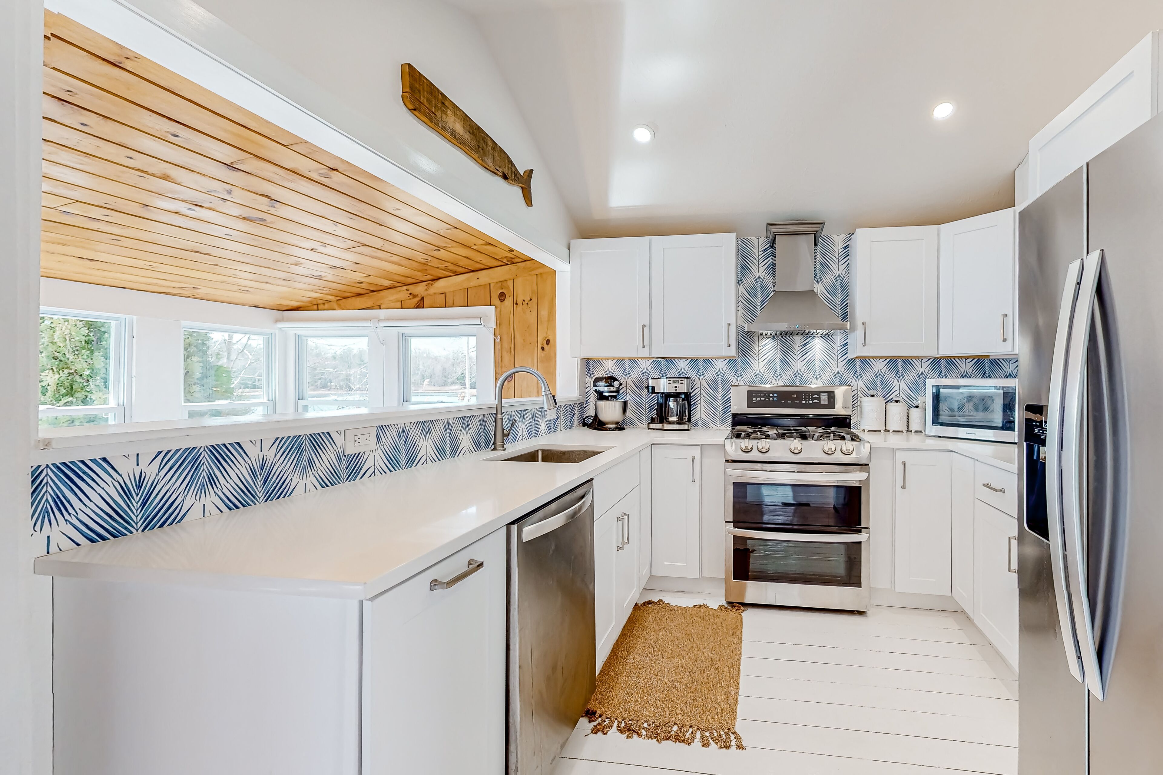 Single-level riverfront retreat with a dock, electric fireplace, & washer/dryer