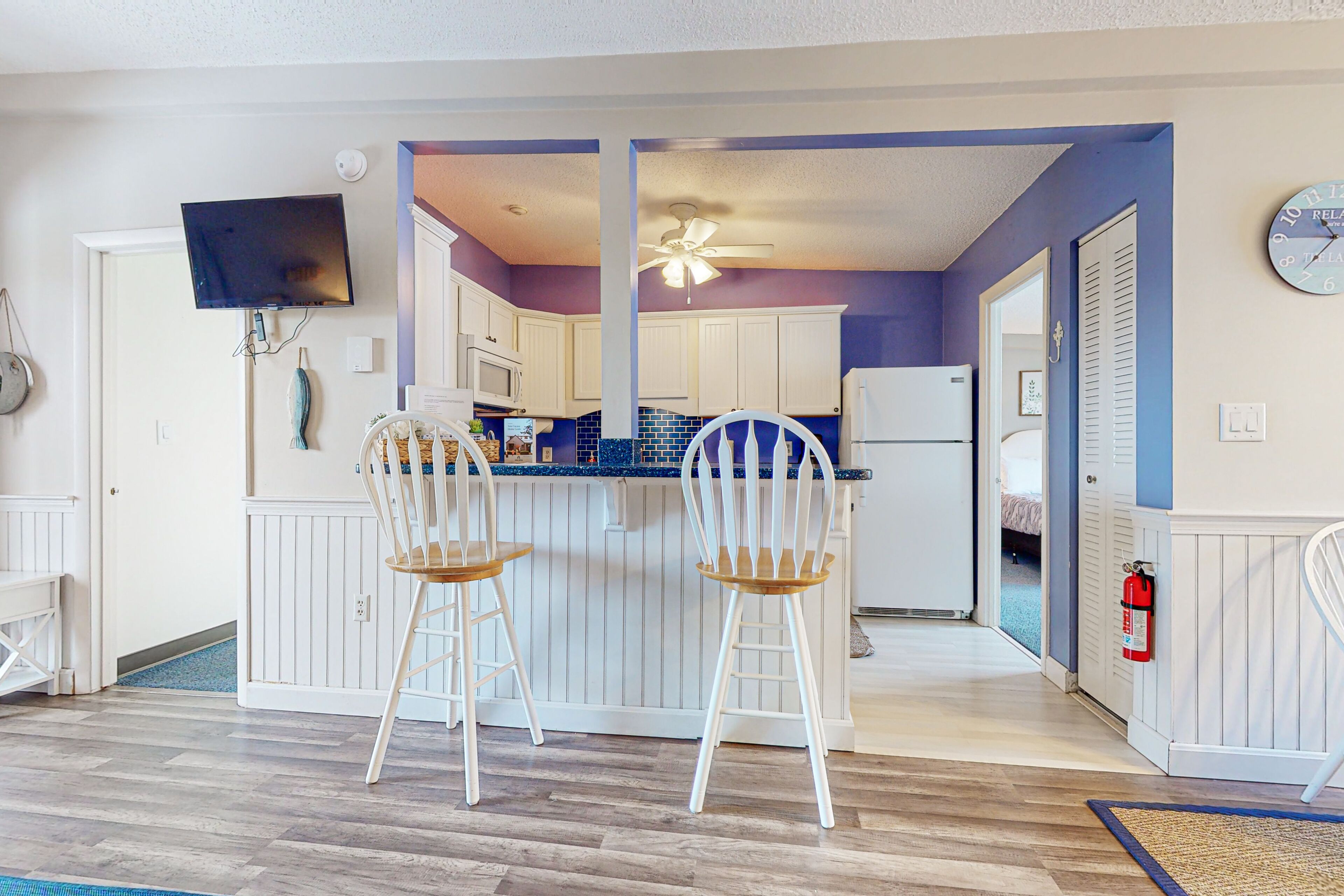 Lake & mountain-view condo with enclosed balcony, W/D, & pool access