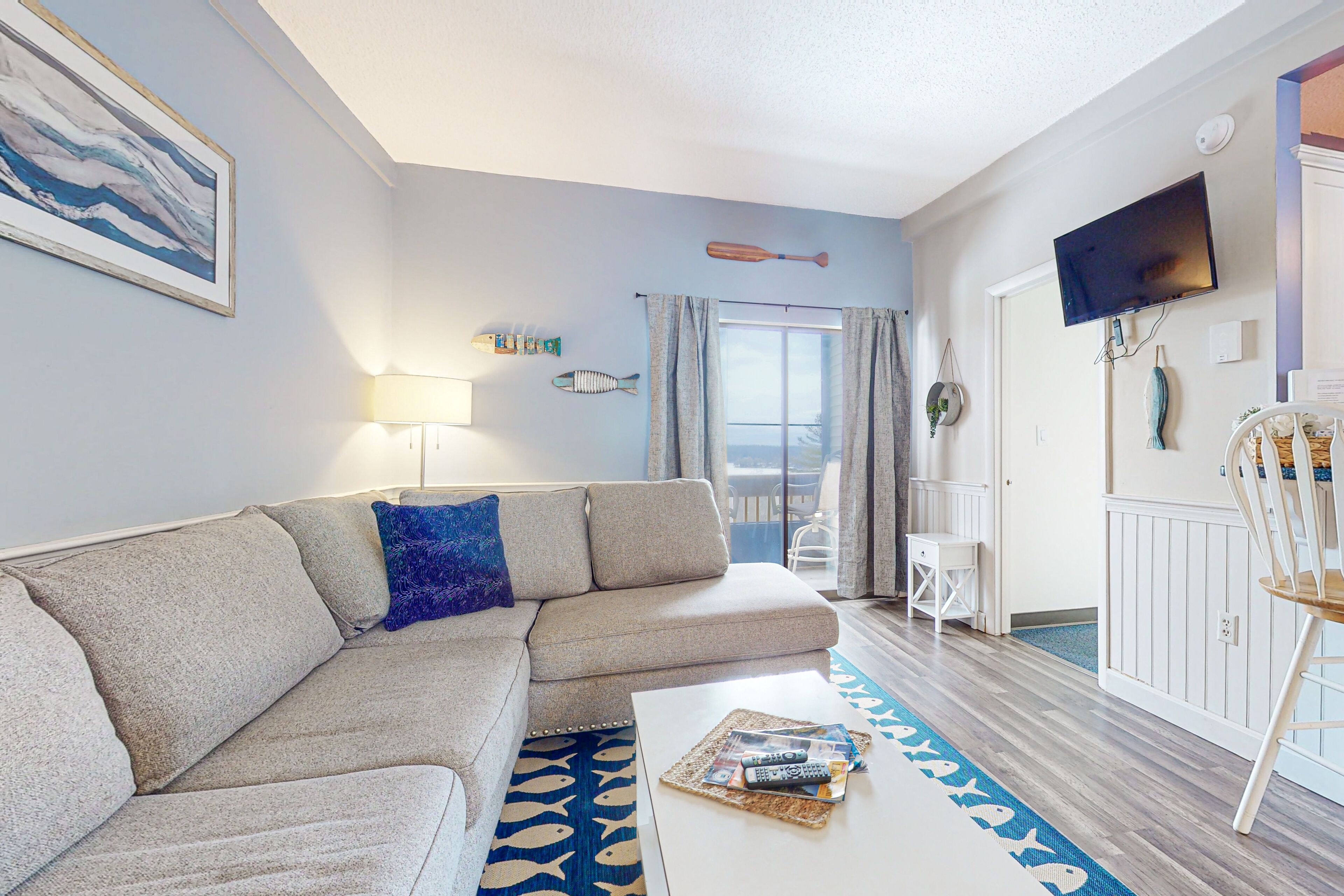 Lake & mountain-view condo with enclosed balcony, W/D, & pool access