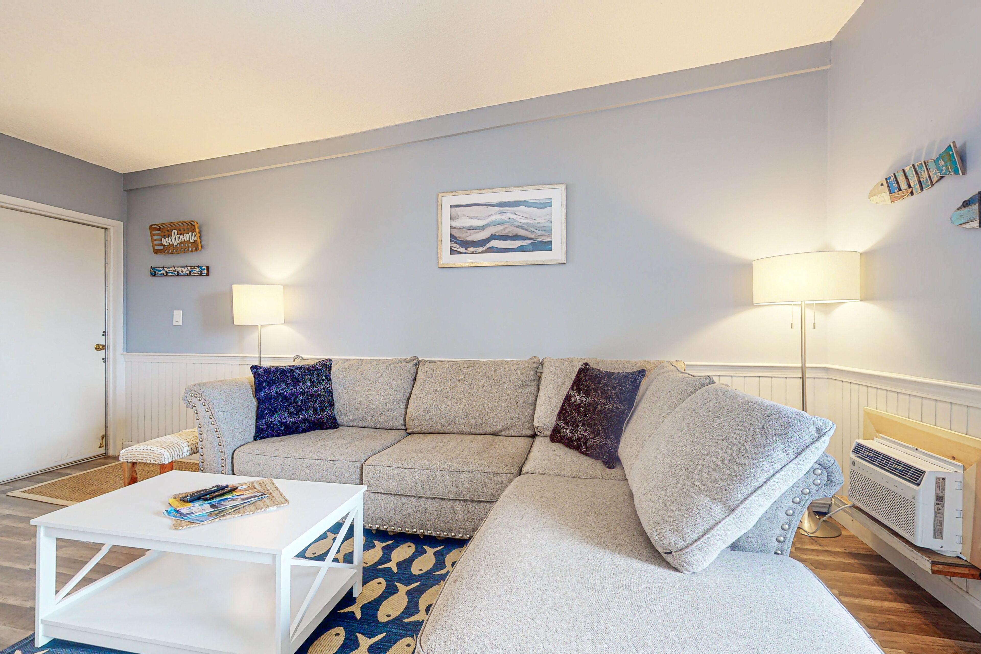 Lake & mountain-view condo with enclosed balcony, W/D, & pool access