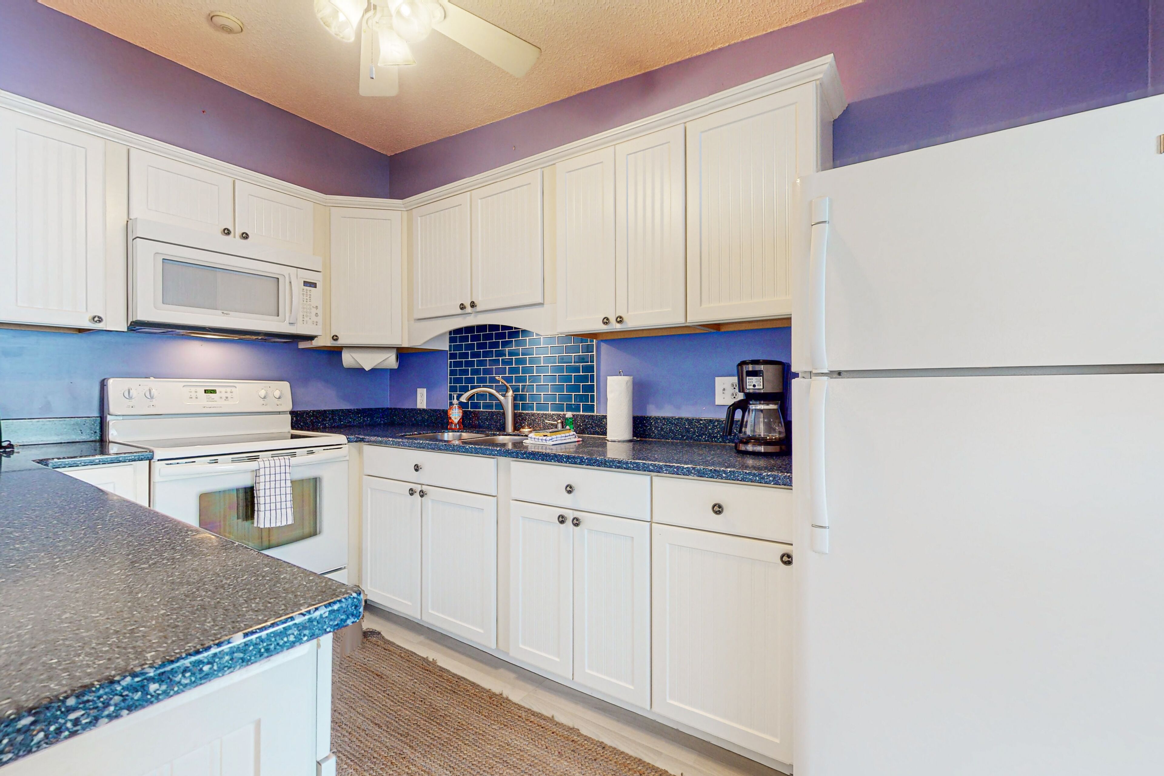 Lake & mountain-view condo with enclosed balcony, W/D, & pool access