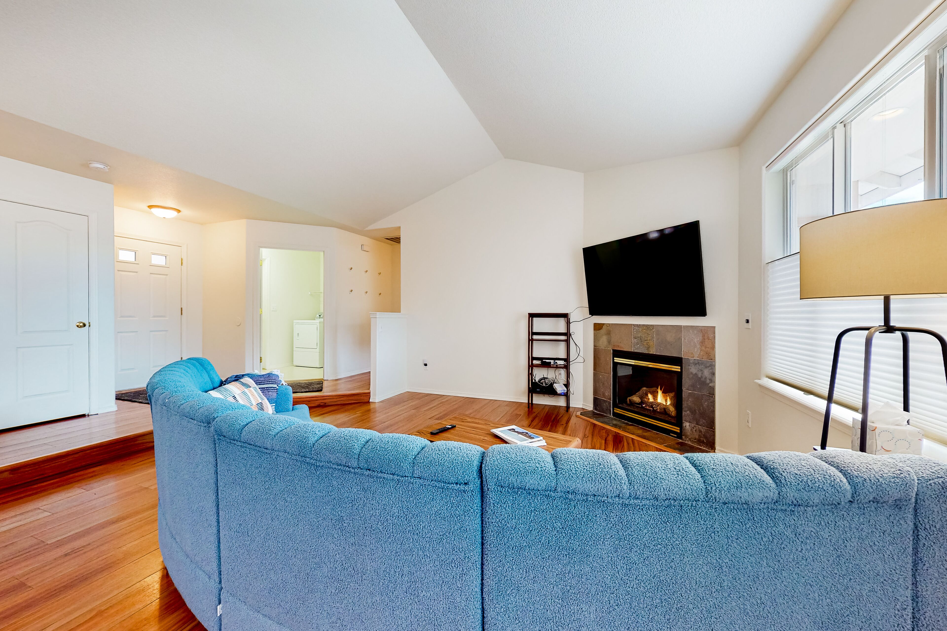 Dog-friendly home with enclosed yard, fireplace, W/D, central AC, & streaming