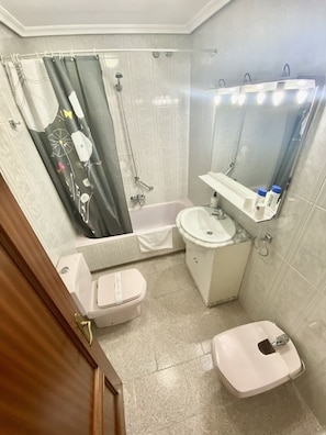 Bidet, towels, soap, shampoo