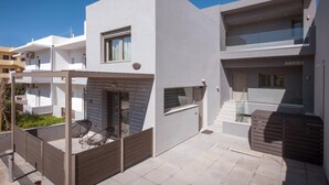 A modern two-story residential building with a flat roof, large windows, and a balcony. - Malia Palace by Luxury Living Apartments (Hersonissos)