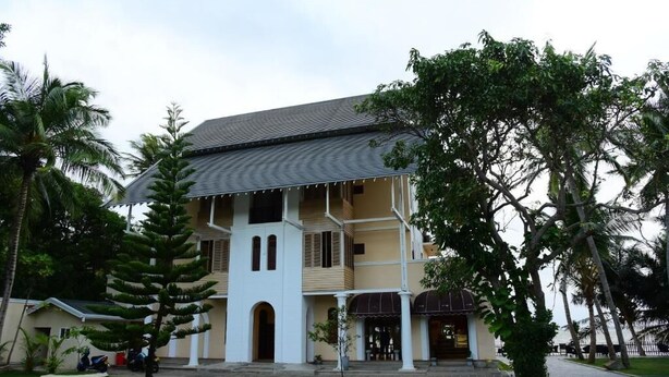 A two-story building with a tiled roof, white walls, and multiple balconies. - Hotel Leaf on Lagoon (Seeduwa - Katunayake)
