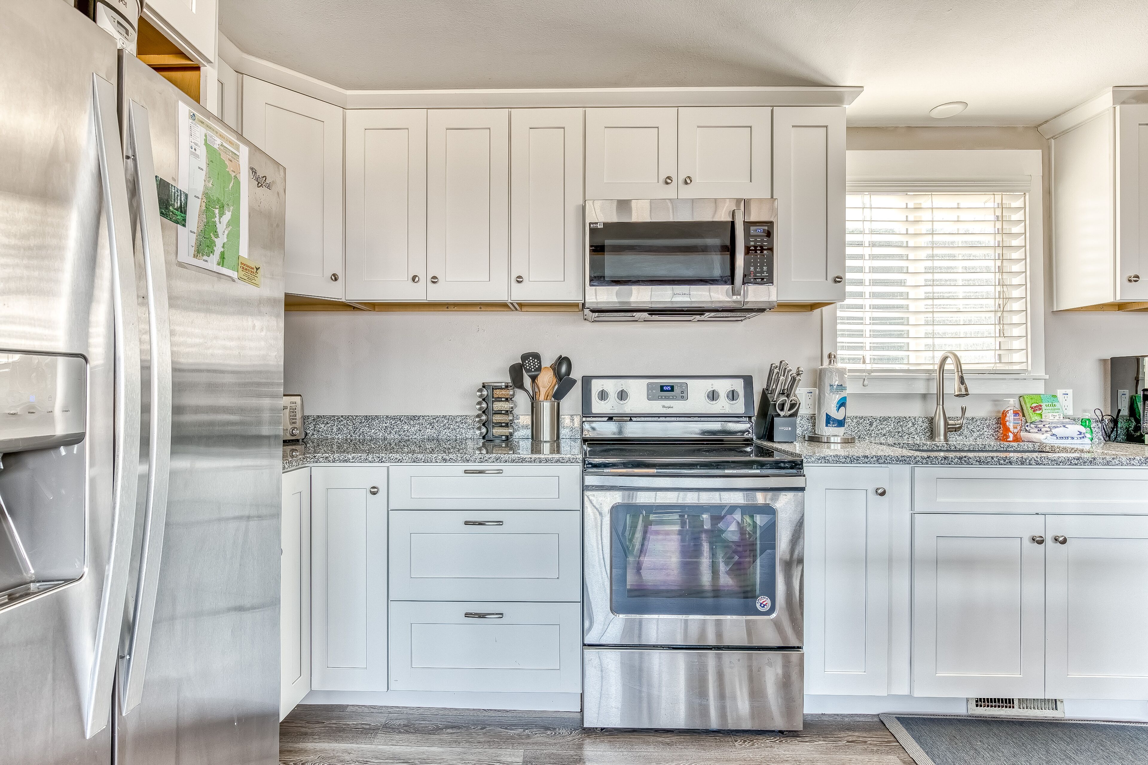 Ocean-view home 1 block from the beach with hot tub, deck, & fireplace