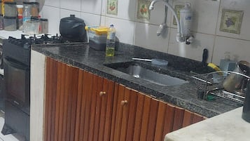 Fridge, microwave, stovetop, cookware/dishes/utensils