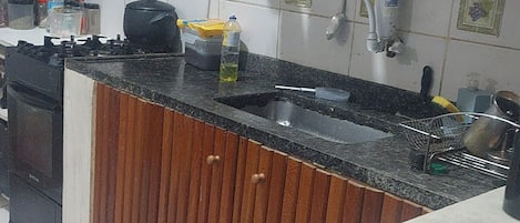 Fridge, microwave, stovetop, cookware/dishes/utensils