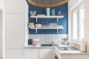 Fridge, microwave, stovetop, cookware/dishes/utensils