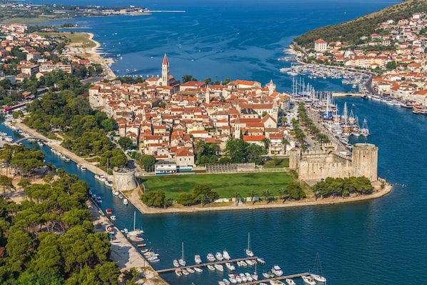 Explore a historic coastal town with a prominent fortress and marina, offering guided tours and access to the sea for boating and fishing.