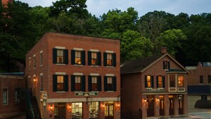 A brick building with a sign for 'Hotel Galena' and 'Eyerbrook Suites'. - Hotel Galena (Galena)