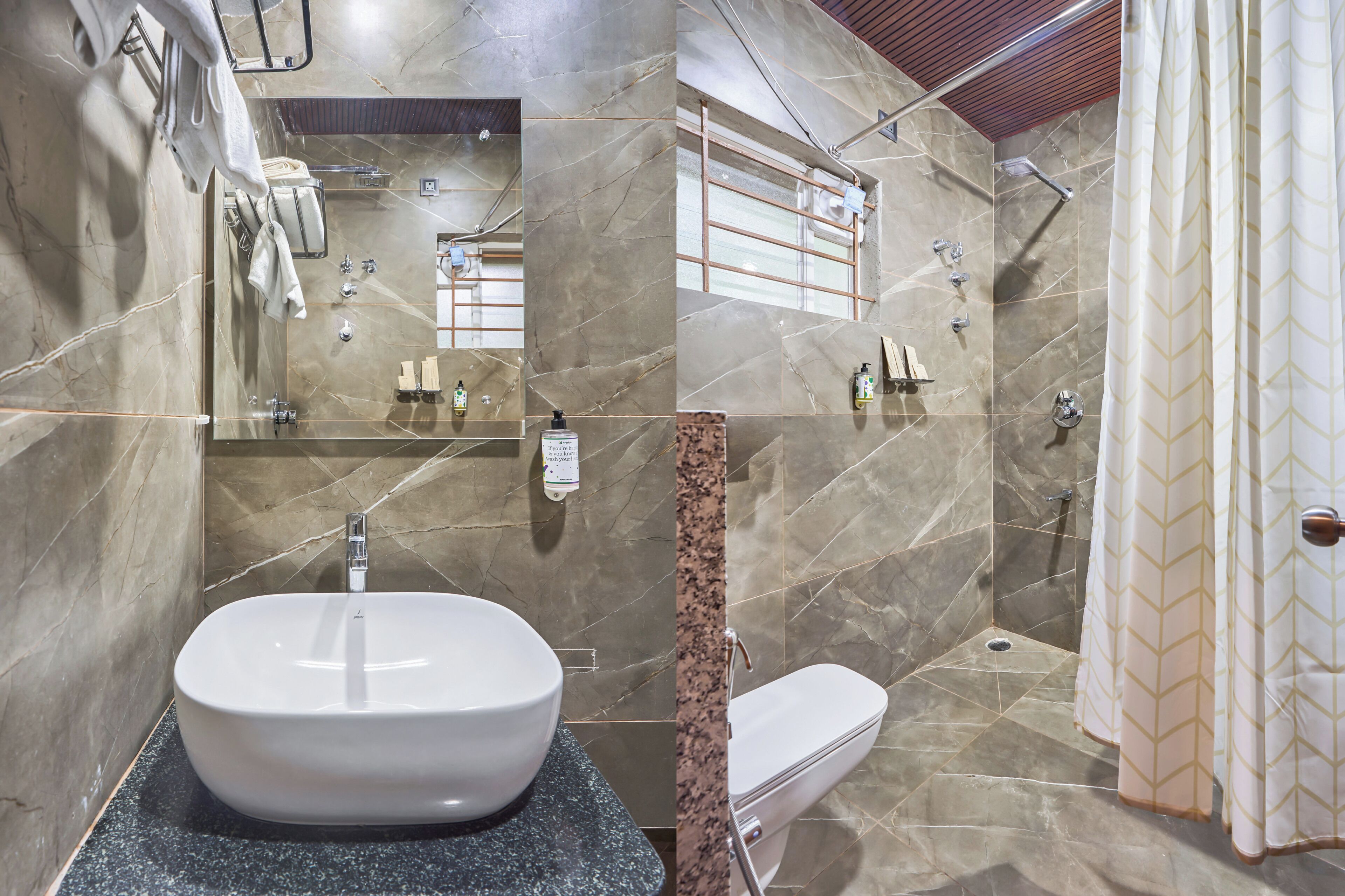 Un baño con un lavamanos grande, inodoro y zona de ducha.