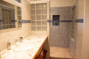 Shower, towels, soap, toilet paper