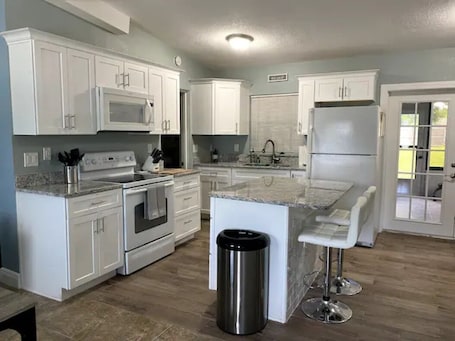 Fridge, microwave, oven, stovetop. Charming 3-bedroom home away from home.