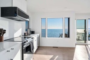 Fridge, microwave, oven, stovetop - Black Swan Beachfront Home with Jacuzzi year round (Hampton Bays)