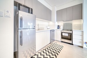 Fridge, microwave, dishwasher, toaster - Graceful 1BR at Park Heights Dubai Hills MBR City by Deluxe Holiday Homes (Dubai)