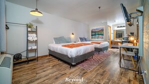 A modern bedroom with two beds, a desk, and a TV. - Peaceful Refuge minutes to SDC with Shuttle (Branson)