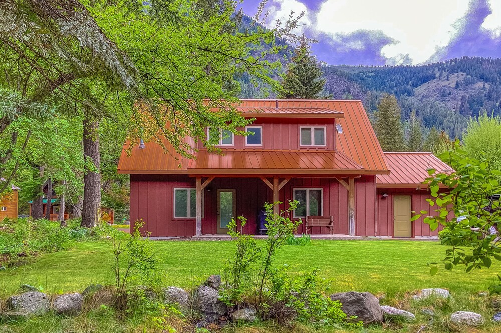 Inviting riverfront home with fireplace, mountain view & W/D - dog-friendly